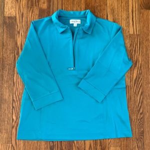 Sporty teal golf top w/ quarter zip and three-quarter length sleeve